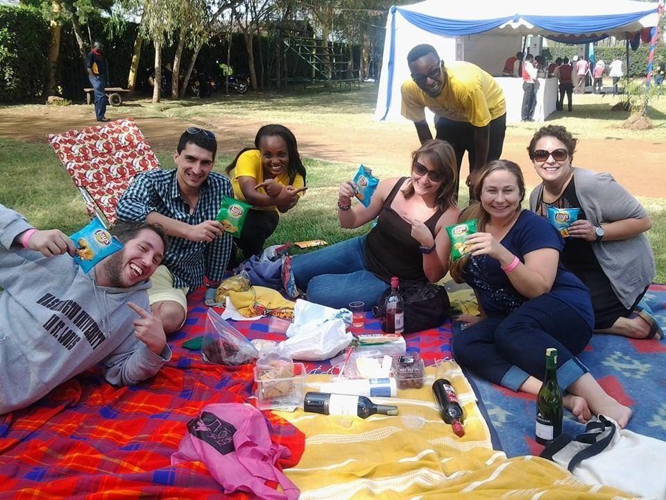 KIWI brand ambassadors with consumers at an outdoor picnic activation