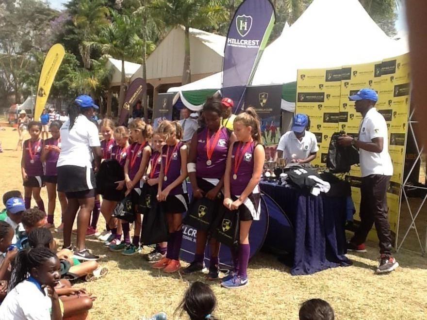 Students receiving medals at a Wadi Degla-branded sports tournament