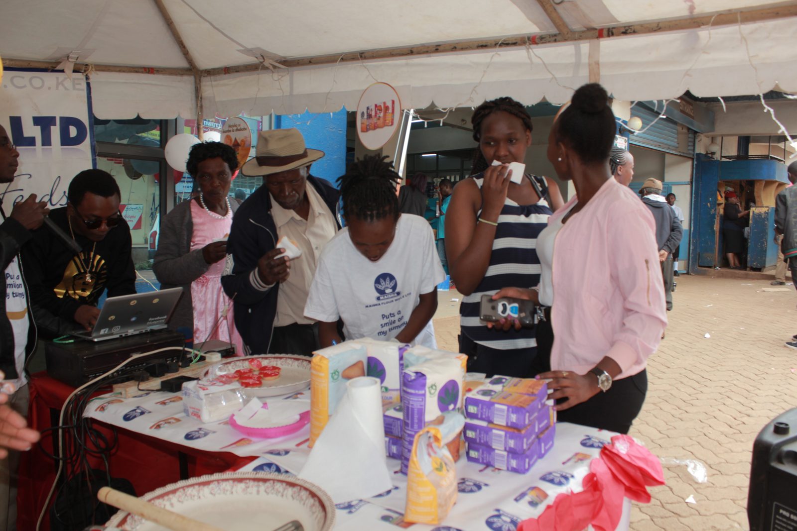 Brand ambassadors running a sampling activation at a market stall