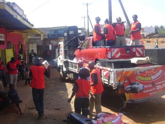 Branded roadshow truck with a crowd in a trading centre